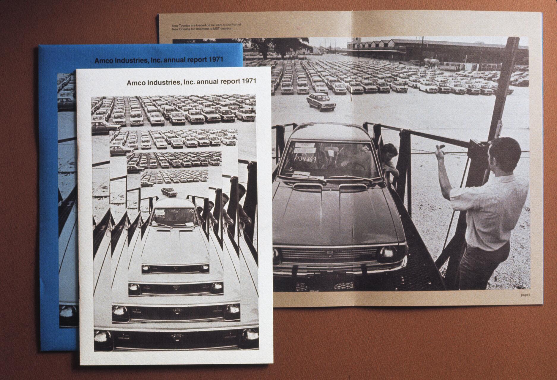 Multiple copies of Amco Industries, Inc. annual report 1971 feature a monochrome image of cars being loaded onto a rail car at a port.