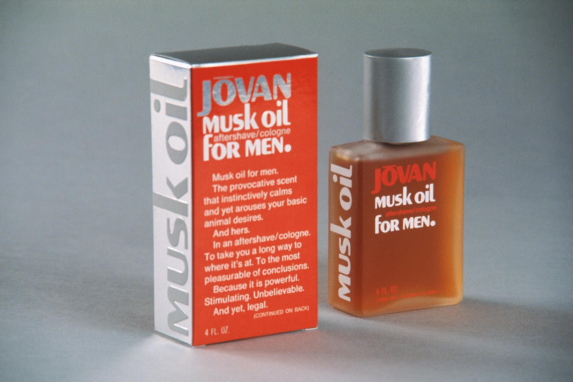 Jovan Musk Oil for Men aftershave/cologne box and bottle, both featuring bold white and red text on a gray background. The bottle has a silver cap and is filled with amber liquid.