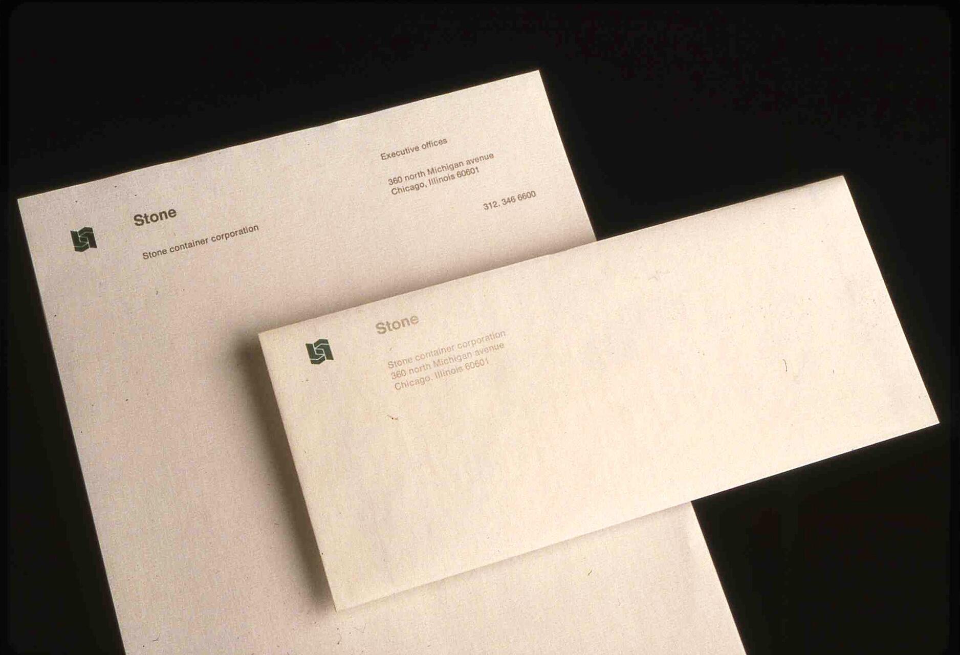 Stationery set with letterhead and matching envelope for Stone Container Corporation, featuring a simple logo and contact information printed on off-white paper.