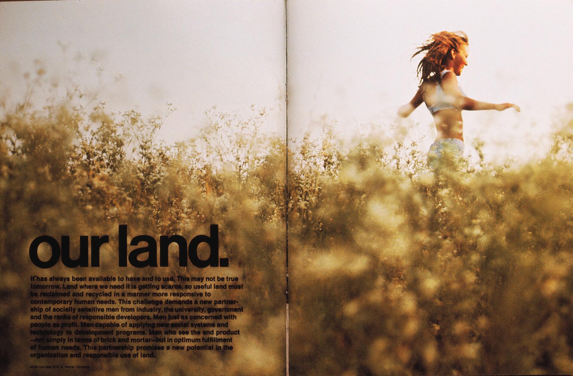 A person running joyfully through a sunlit, overgrown grassy field with blurry foreground, and large text reading “our land” occupying the left side.