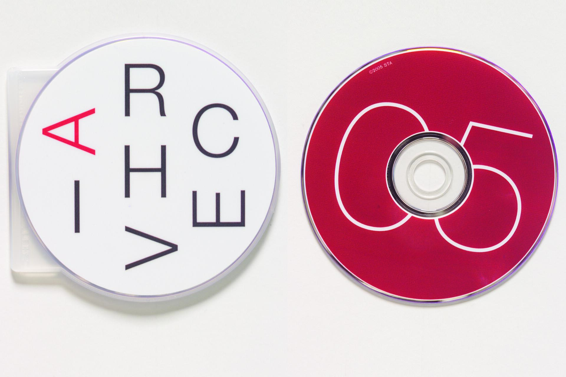 Two CDs are shown. The left CD case is white with black letters and a red "A". The right CD is red with a large white "05".