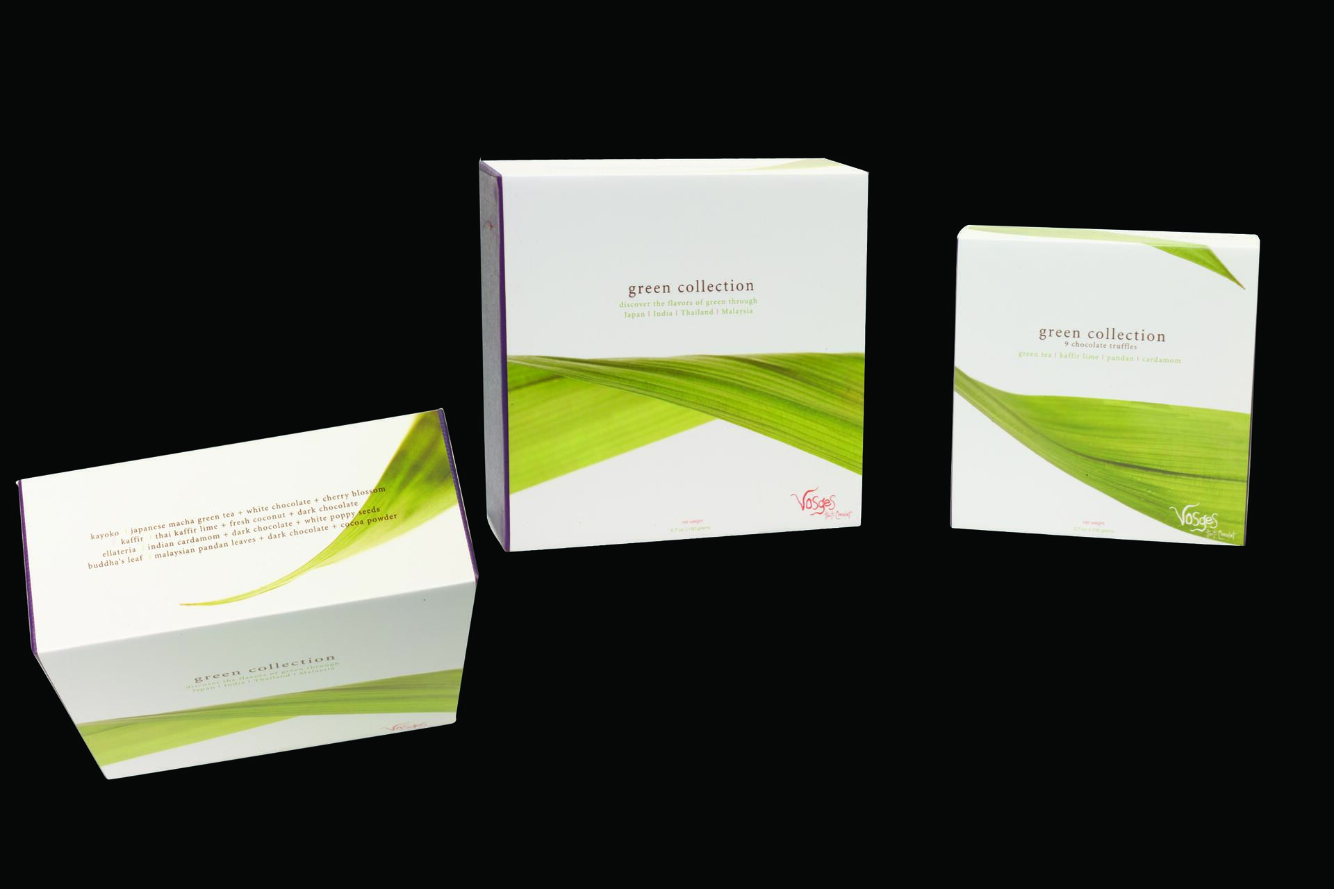 Three boxes of "Green Collection" chocolate truffles, featuring green leaf imagery on white packaging with text highlighting flavors like green tea and kaffir lime.