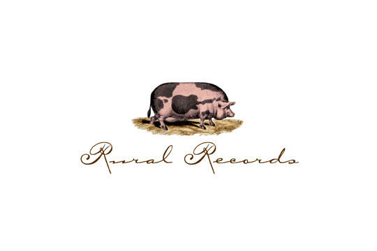 A logo featuring a pig standing on hay, with cursive text underneath.