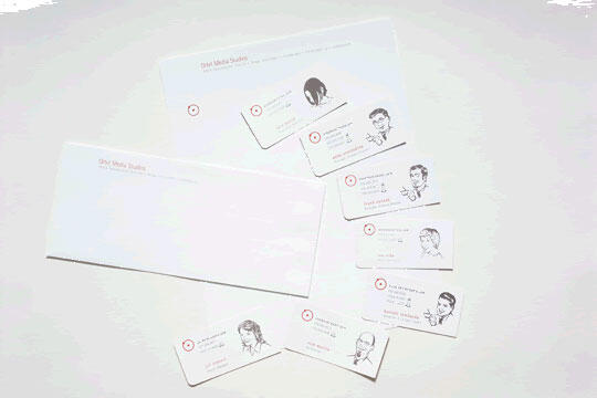 Stationery set with an envelope and several business cards featuring simple line drawings of people, each with a unique portrait. The design is minimalist, primarily using white with subtle text and logos.