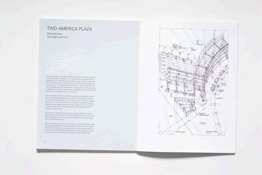 Open book showing a page of text about "Two America Plaza" on the left and a detailed architectural sketch on the right. The text provides information about an office building located in San Diego, California.
