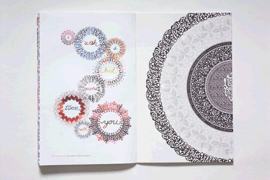 Open book displaying intricate circular designs. Left page features colorful, decorative circular patterns with words inside. Right page shows a large, detailed monochrome mandala with black and gray patterns.