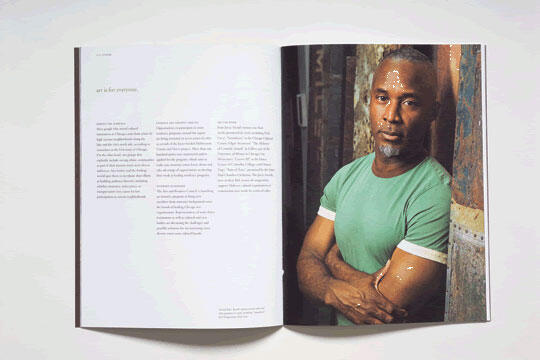 Open magazine showing a portrait of a man in a green shirt on the right page and text on the left page.