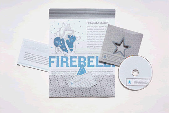 Brochure with "FIREBELLY" text in blue, a stylized heart illustration, and a small card on a gray background. A CD with a star design is partially visible.