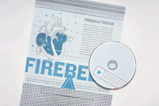 Promotional flyer and CD featuring "Firebelly Design," with blue graphics of a heart and large text. The CD rests partially over the flyer. The design includes stars and textured patterns.