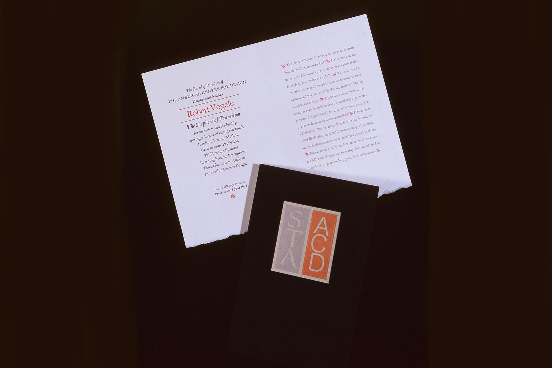 Certificate honoring Robert Vogele for leadership, with black cover featuring STA and ACD initials in colored squares.