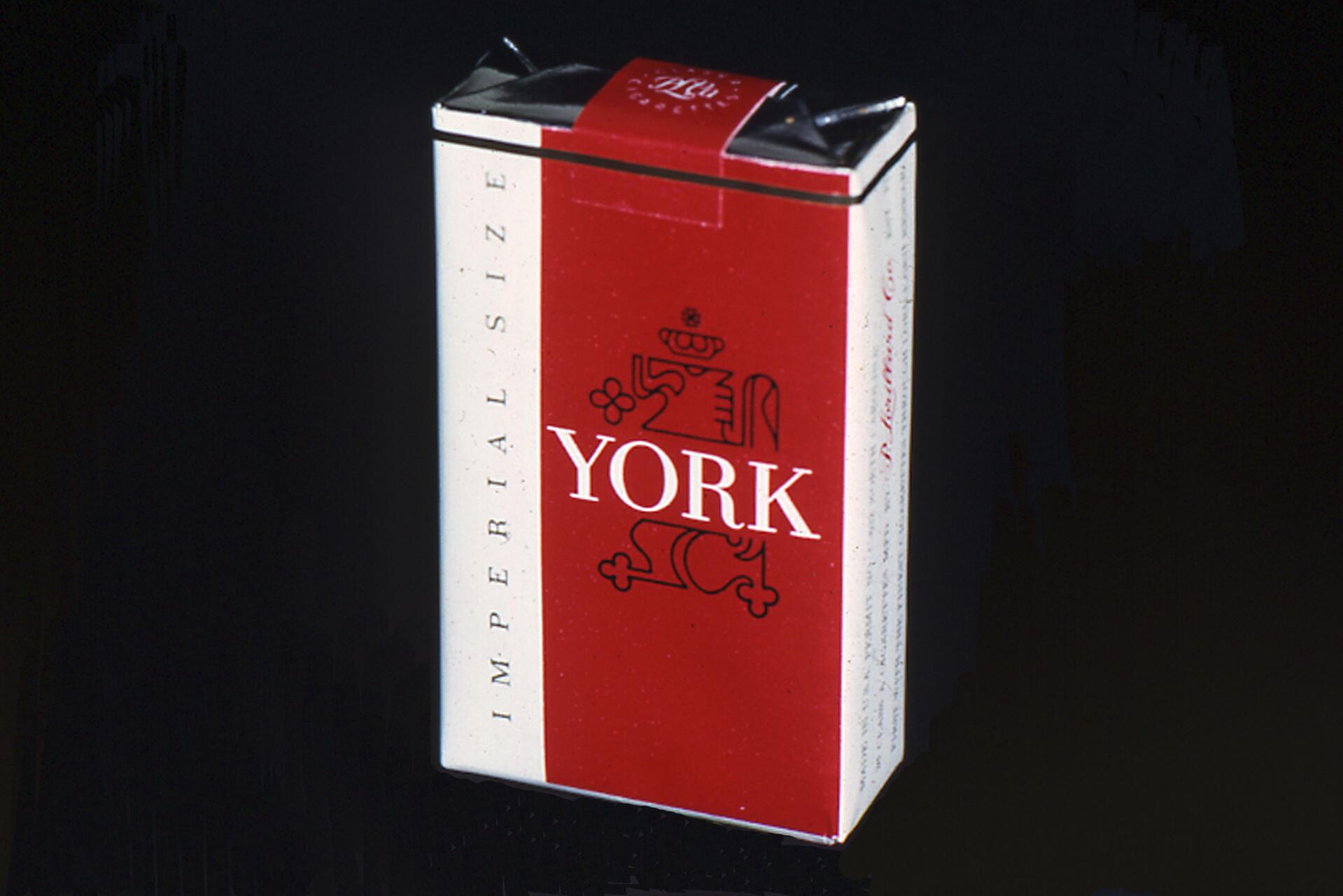Pack of York cigarettes with a red and white design, featuring a stylized emblem and the word "York" in bold letters.
