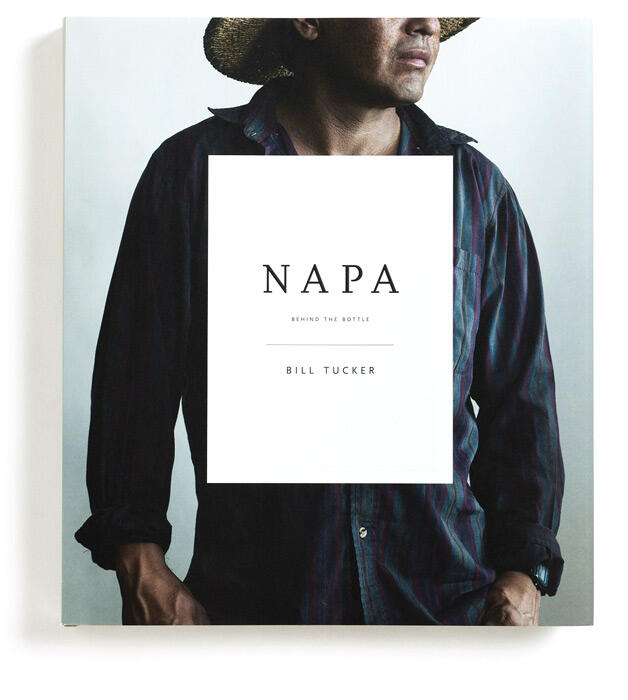 Book cover titled "Napa: Behind the Bottle" by Bill Tucker, featuring a photograph of a person wearing a dark striped shirt, partially shown from the chest down, with a straw hat casting a shadow on the head and face.
