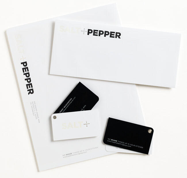 Branding materials featuring the "Salt+Pepper" logo on a white and black color scheme, including letterheads, envelopes, and business cards.
