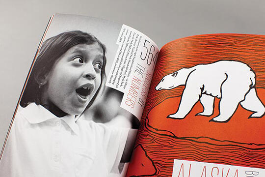 Open book with a black-and-white photo of a surprised child on the left page, and an illustration of a white polar bear on a red background on the right page.