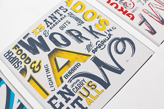 Typography artwork featuring various overlapping words and phrases in different styles and colors, primarily yellow, black, and blue.