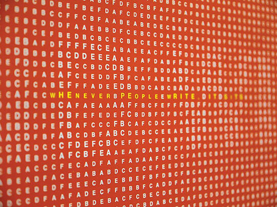 White letters scattered across a red background, with the phrase "WHENEVER PEOPLE WRITE..." in yellow letters in the center.