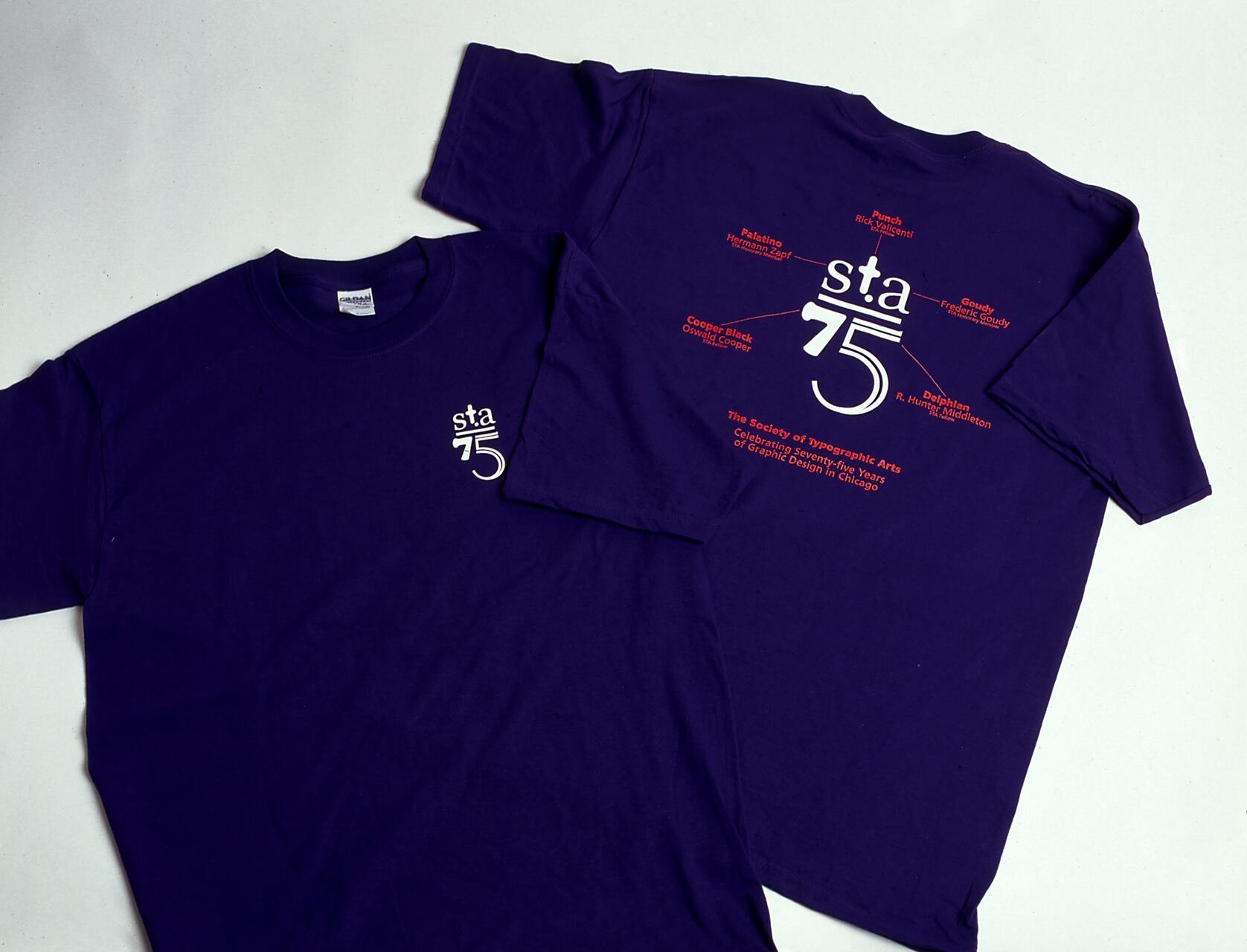Purple T-shirts with "sta 75" logo. Front shirt shows small logo. Back shirt features larger logo and red text celebrating seventy-five years of graphic design in Chicago.