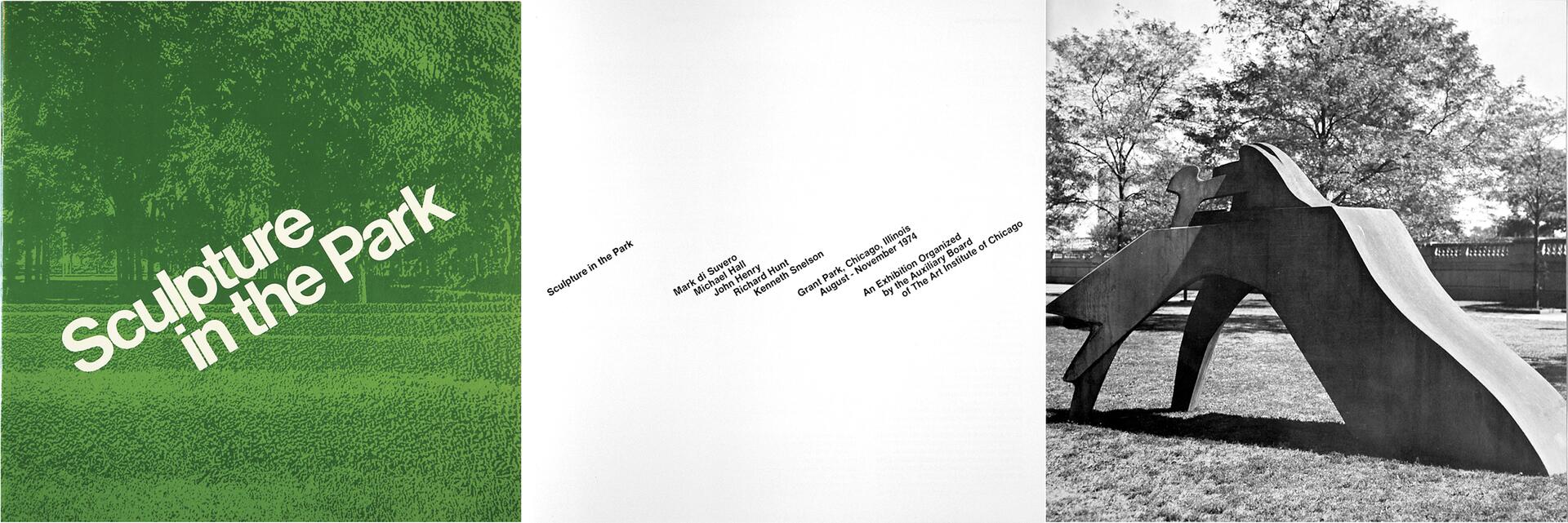 A black and white photograph of a large, abstract metal sculpture positioned in a park. The sculpture is angular and dynamic, set on a grassy lawn, with trees and a fence in the background.