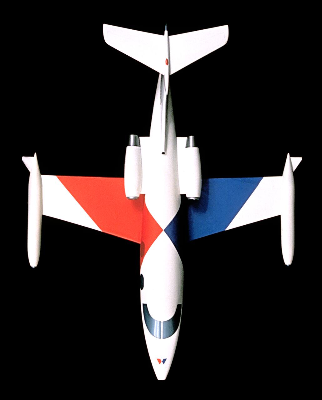Stylized aircraft on a black background with a white body, featuring red and blue triangular patterns on the wings.