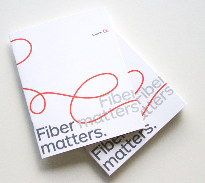Two overlapping brochures with a red swirl design and the text "Fiber matters" in bold gray letters.