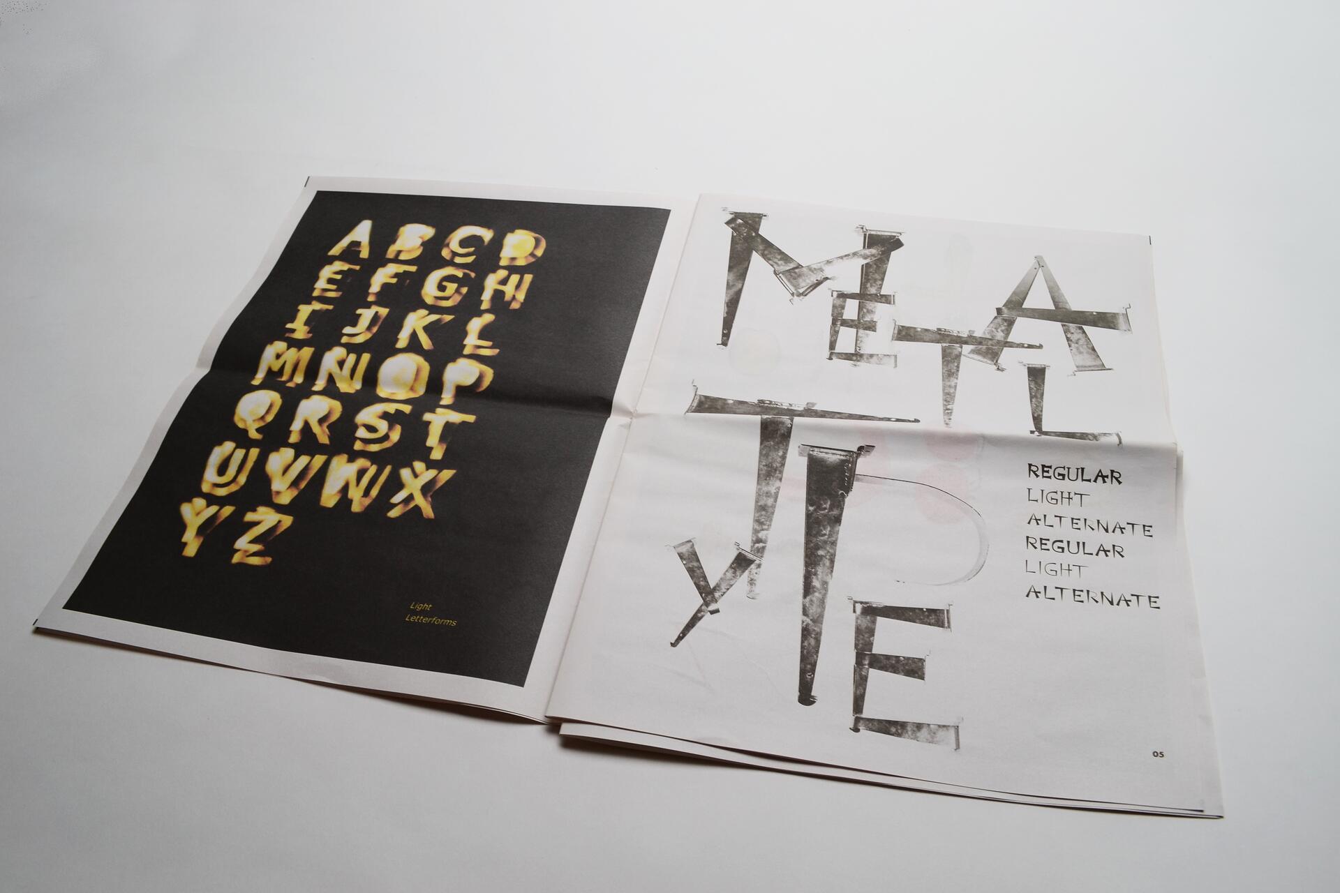 Two open magazines on a table. The left page features yellow distorted letters from A to Z on a black background. The right page displays the word "METAL TYPE" in a grungy font, alongside the words "REGULAR," "LIGHT," and "ALTERNATE."