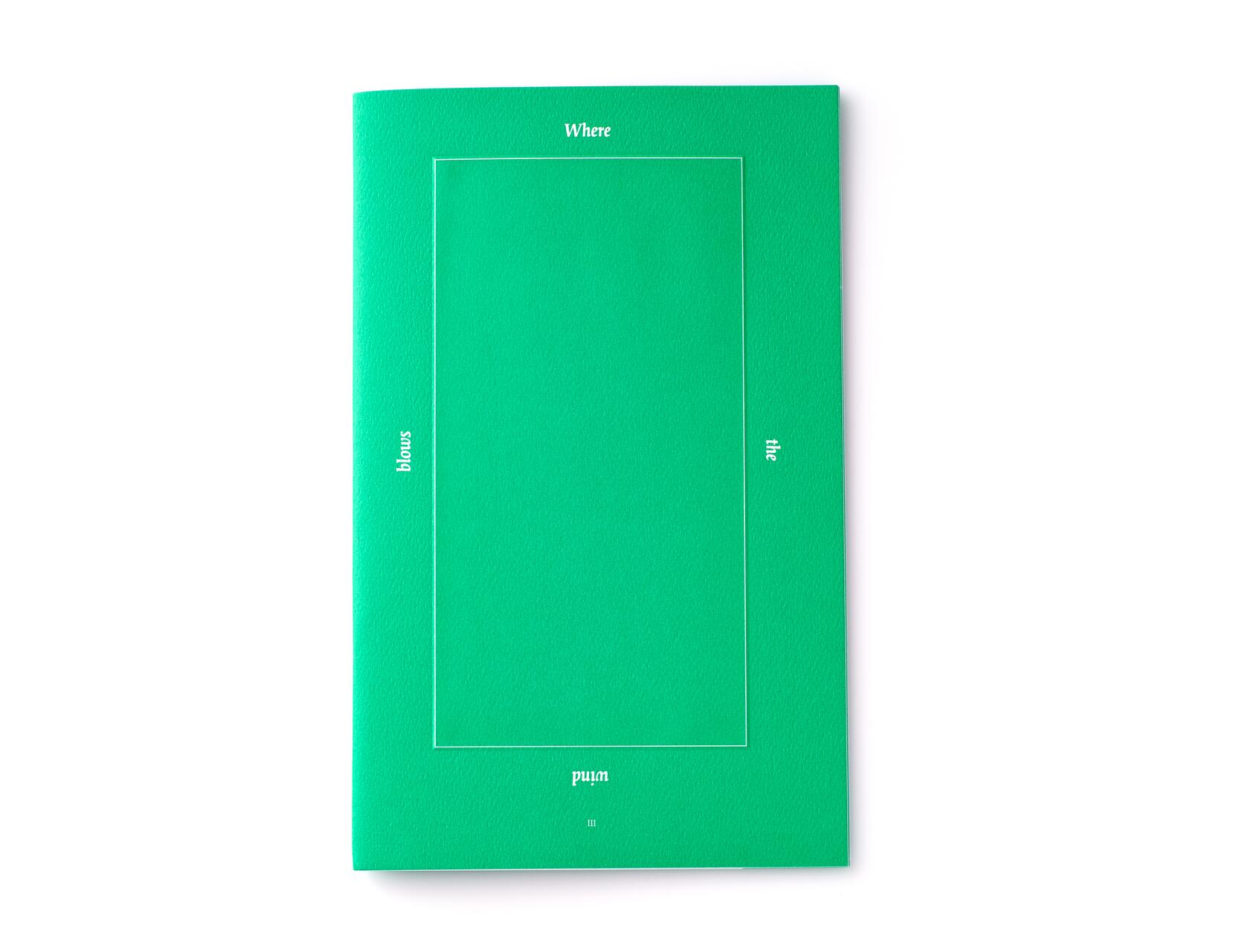 Green booklet with white text arranged around a rectangle, reading "Where the wind blows."