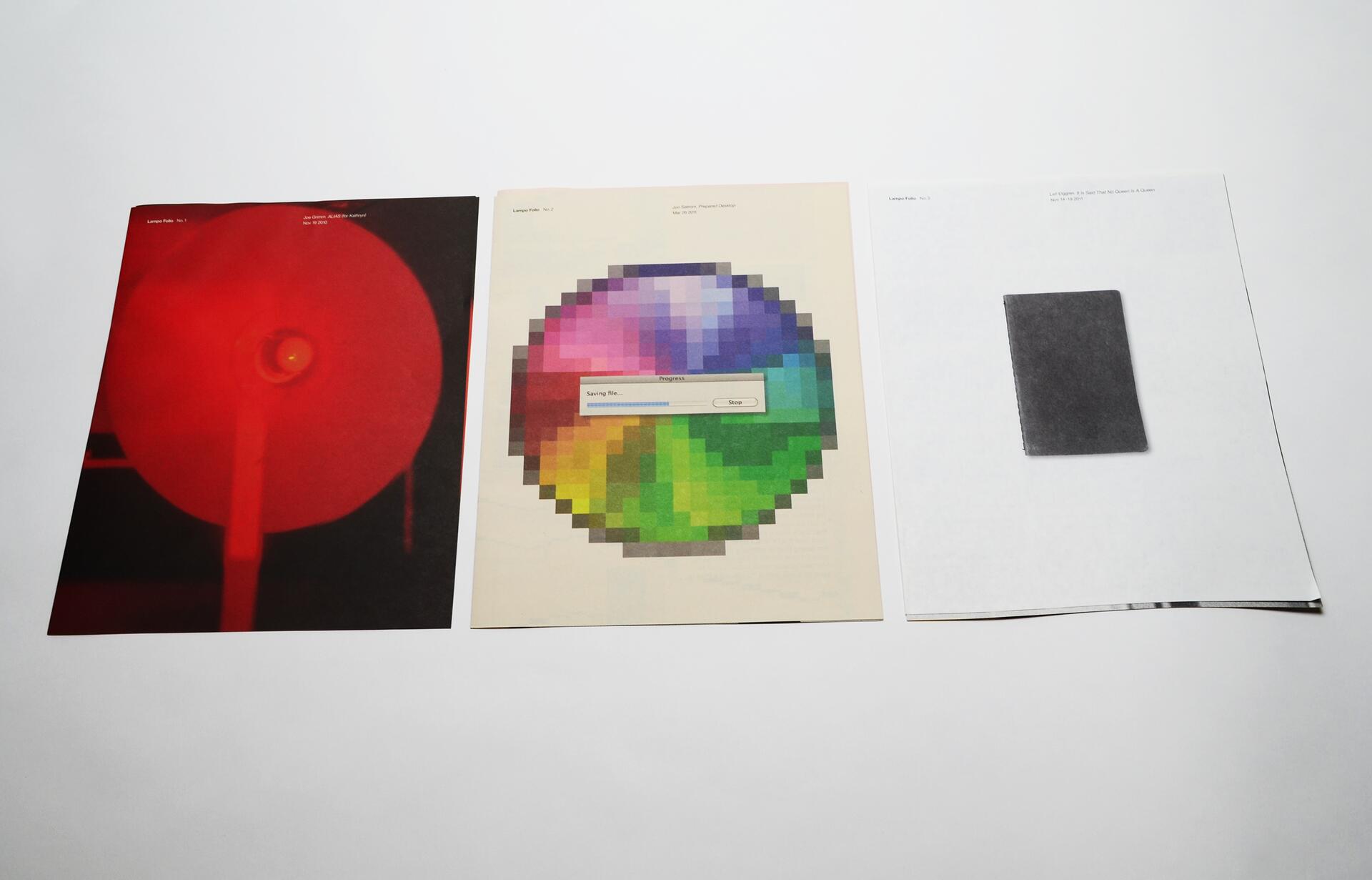 Three sheets on a white surface. Left: red filter effect over a circular shape. Middle: pixelated color wheel with saving progress bar. Right: small dark rectangle on white background.