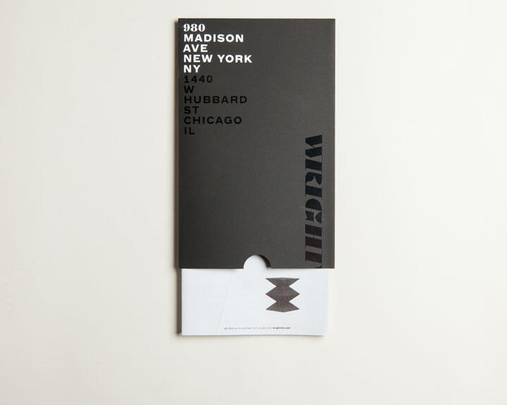 Black card with "980 Madison Ave, New York, NY" and "1440 W Hubbard St, Chicago, IL" in white text, and "WRIGHT" in black. White envelope with black geometric design partially visible beneath.