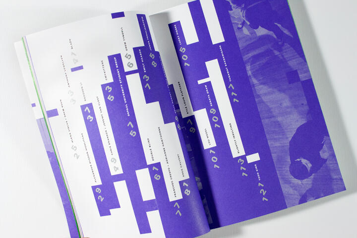 Open magazine with a modern design featuring large purple blocks, numbers, and vertical text. The right page includes a purple-toned photograph of two people viewed from above.