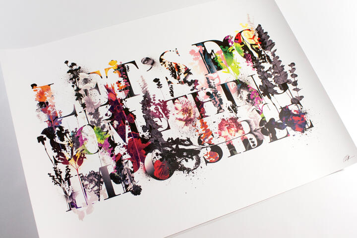 Colorful floral typography artwork with splatters and paint drips spells out an inspirational phrase.