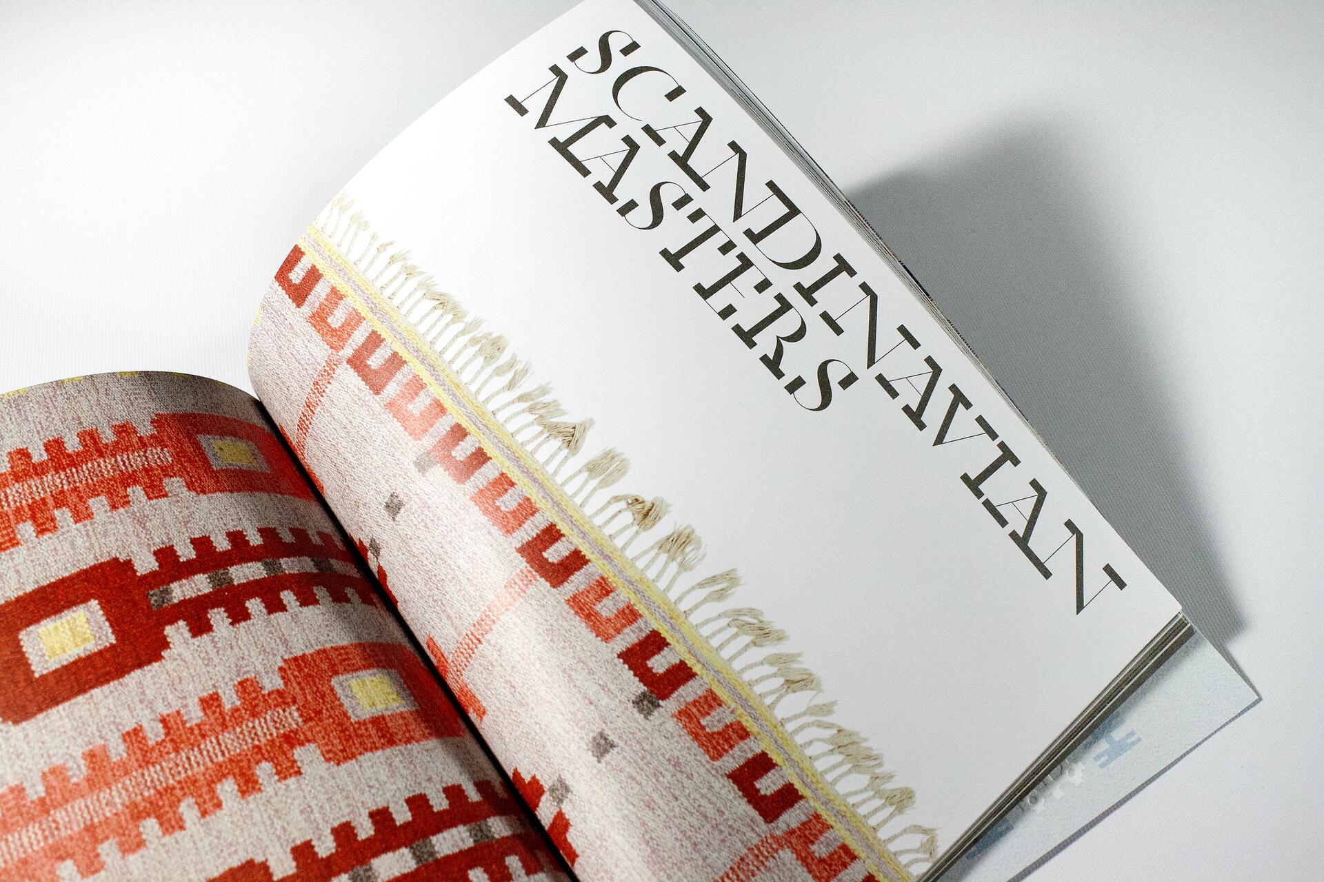 Open magazine showing a page with "SCANDINAVIAN MASTERS" in bold letters, next to a colorful woven textile with geometric patterns in red, orange, and yellow.
