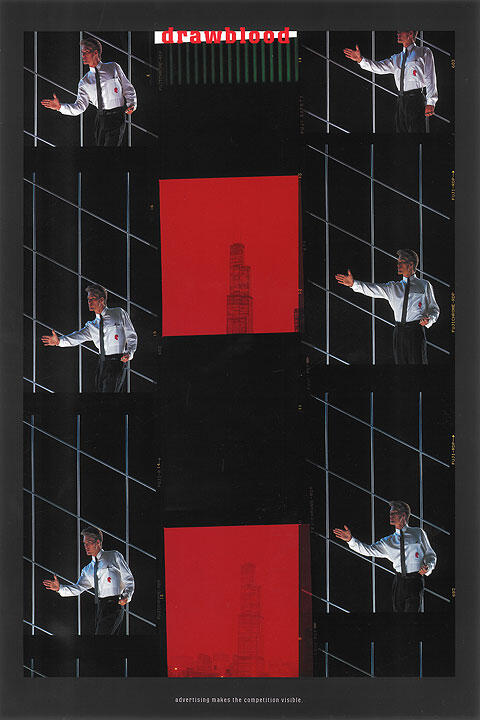 Man in white shirt gestures against a grid pattern backdrop; central red square with a faint tower sketch.