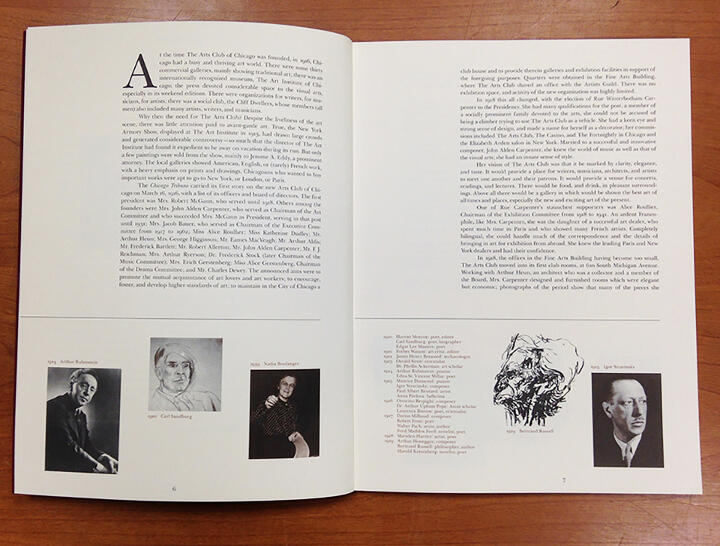 Open book laid on a wooden table, featuring text and black-and-white photographs on both pages, including portraits and illustrations. Some text visible but not fully readable.