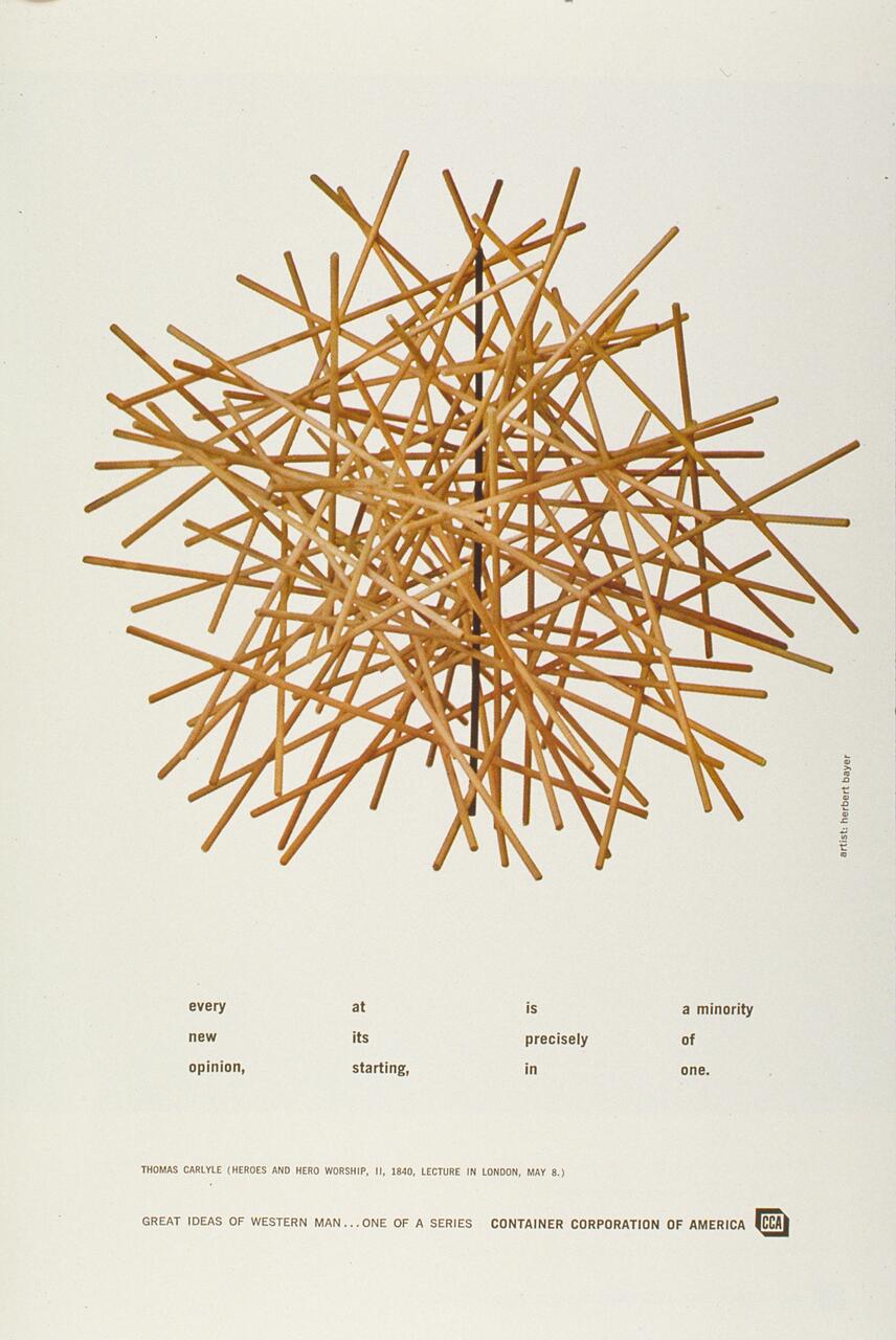 A sculpture made of interlocking wooden sticks forming a complex star-like shape against a plain background.