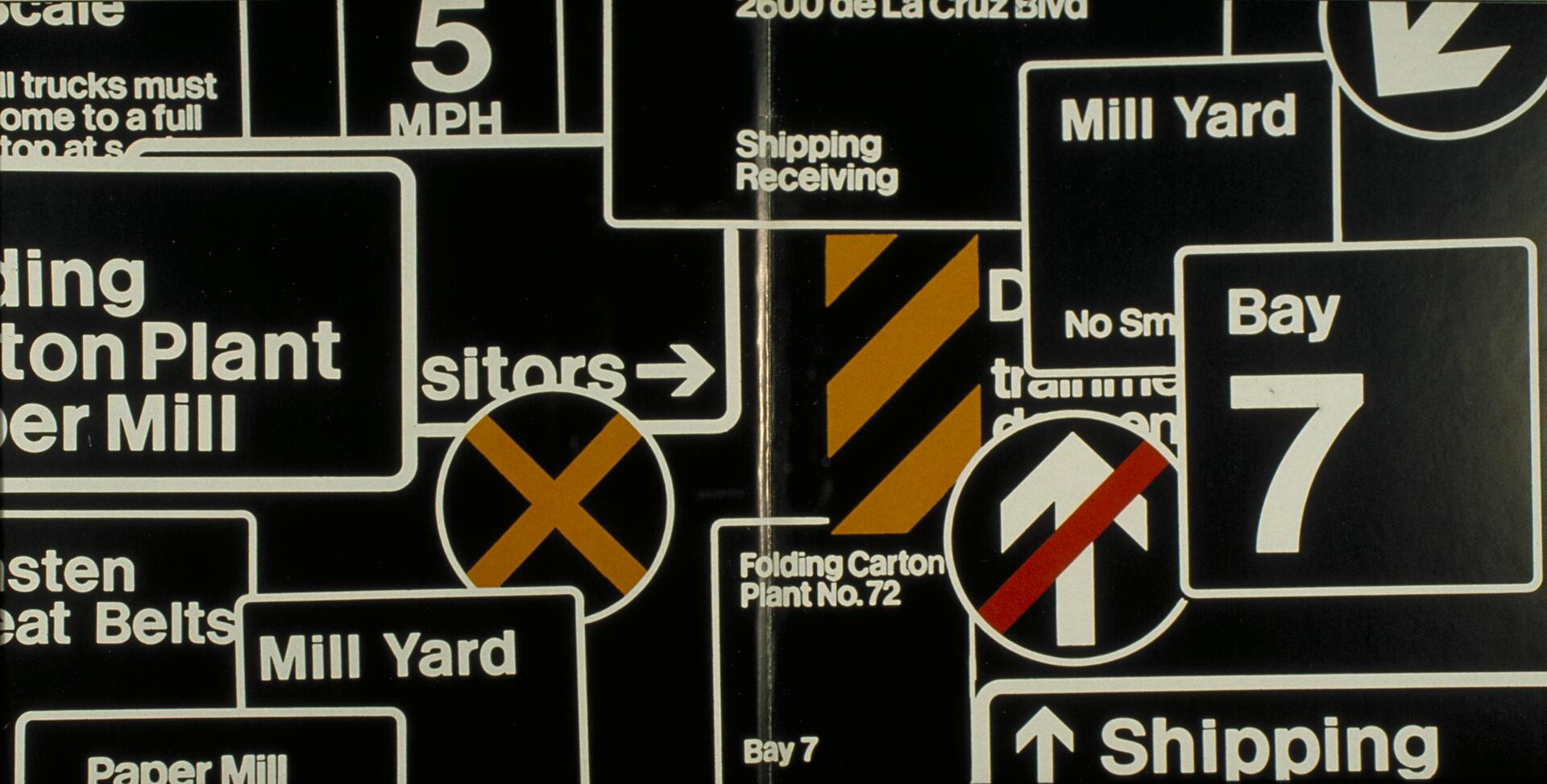 Collage of overlapping traffic and industrial signs with various directives, including arrows, speed limits, and prohibition symbols, on a dark background.