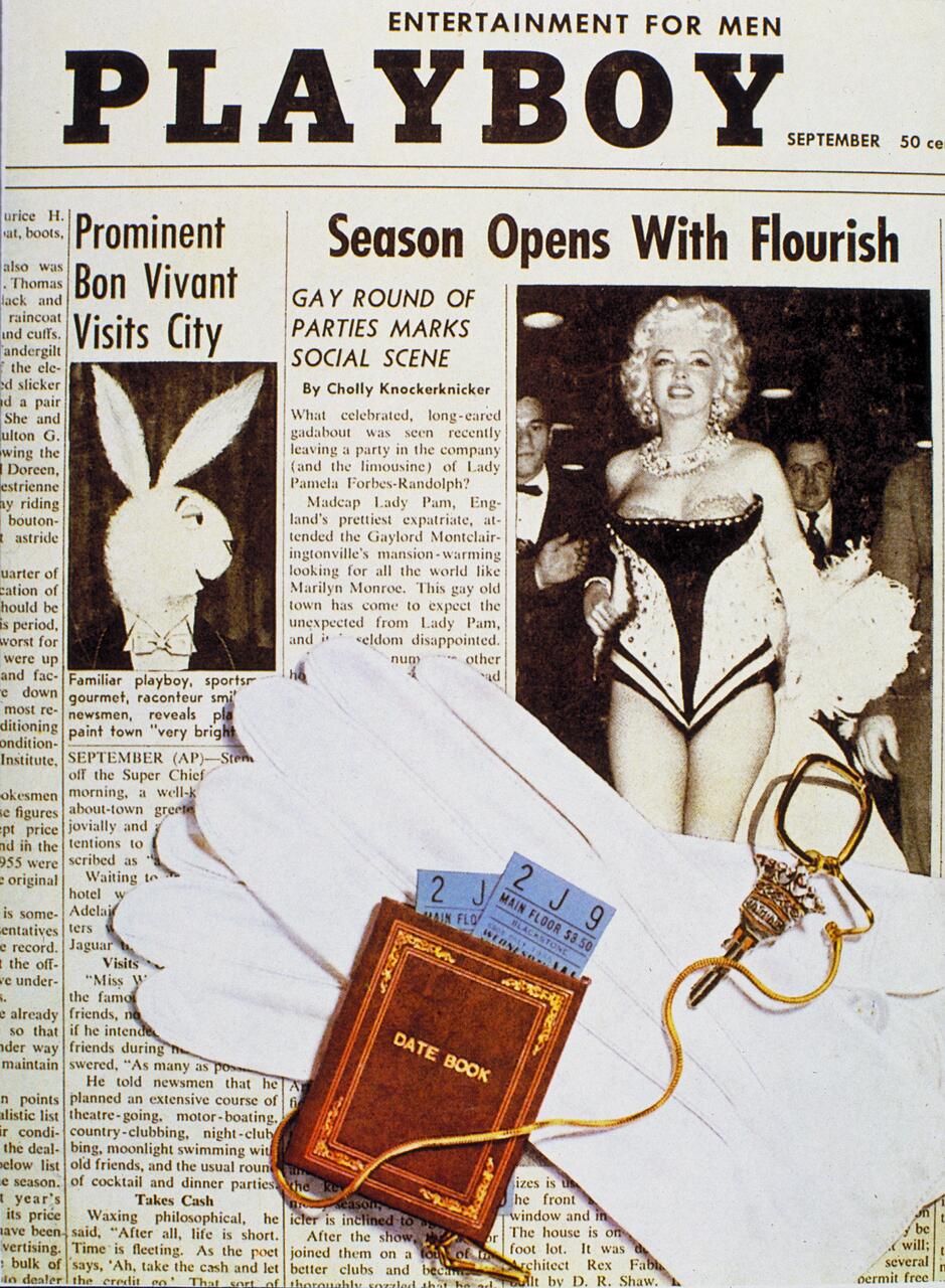 Playboy magazine cover featuring a black-and-white photo of a woman in a corset, surrounded by articles. White gloves, a date book, tickets, and a keychain with a Playboy bunny charm are in the foreground.