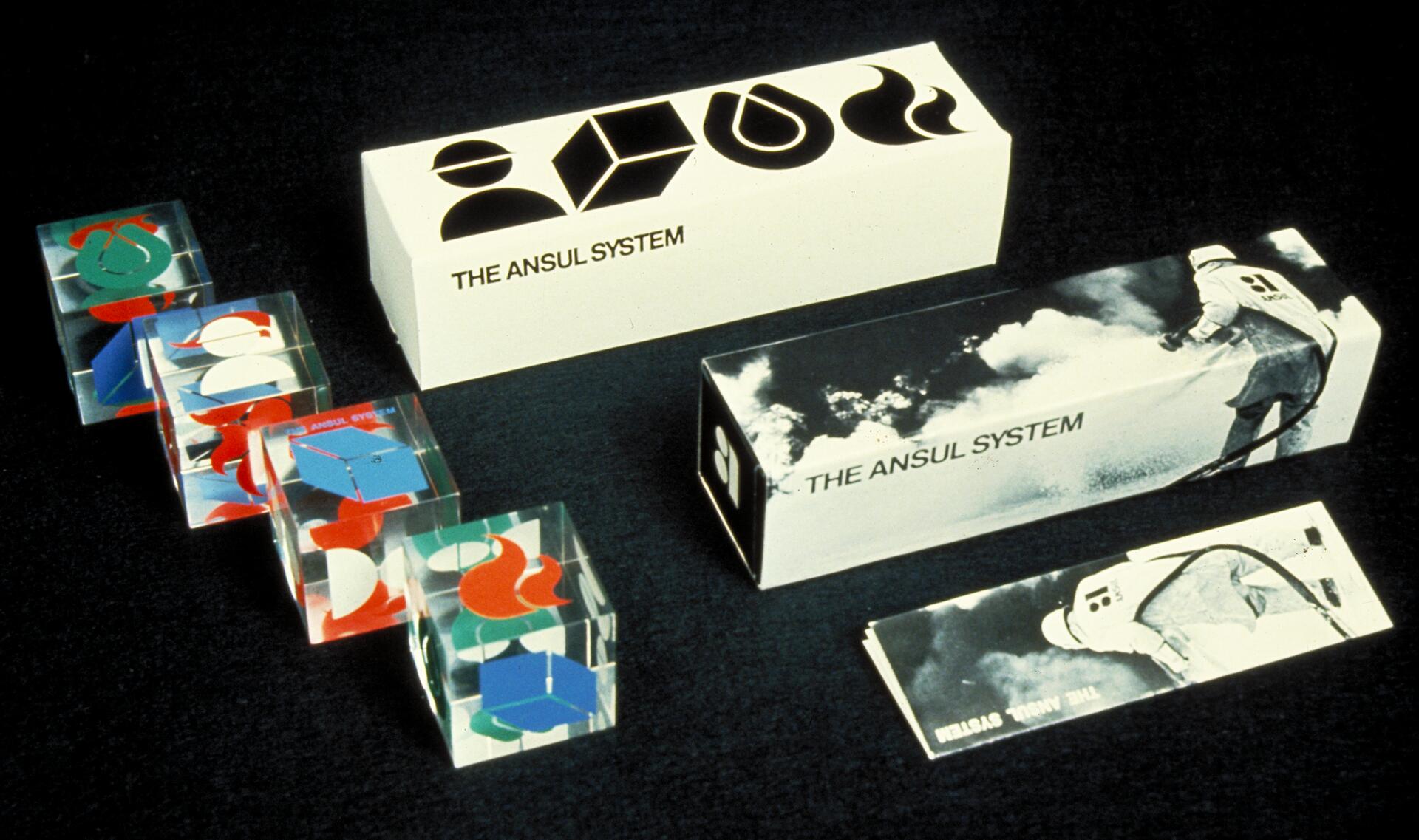 Packaging design for "The Ansul System" featuring abstract shapes and a photograph of a firefighter using a hose.