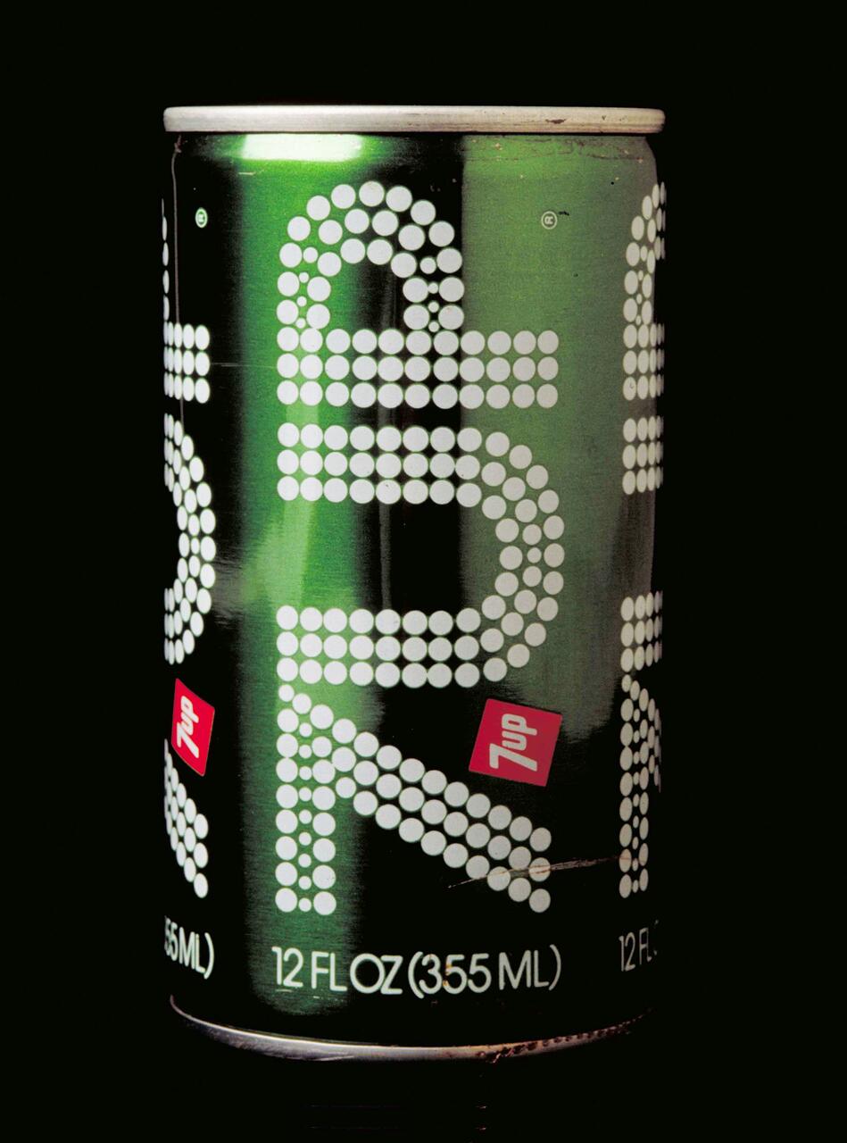 Green can of 7UP soda with white dotted designs and red logo, 12 fl oz (355 ml) capacity, on a black background.