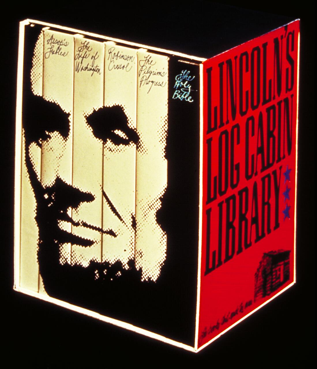 Box resembling a book set titled "Lincoln's Log Cabin Library," featuring a monochrome pixelated image of Abraham Lincoln's face on the spines, with a red side panel displaying the title and stars.