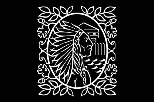 Intricate white tribal-style emblem featuring a profile of a person in a feathered headdress, surrounded by ornate leaves and geometric patterns, on a black background.