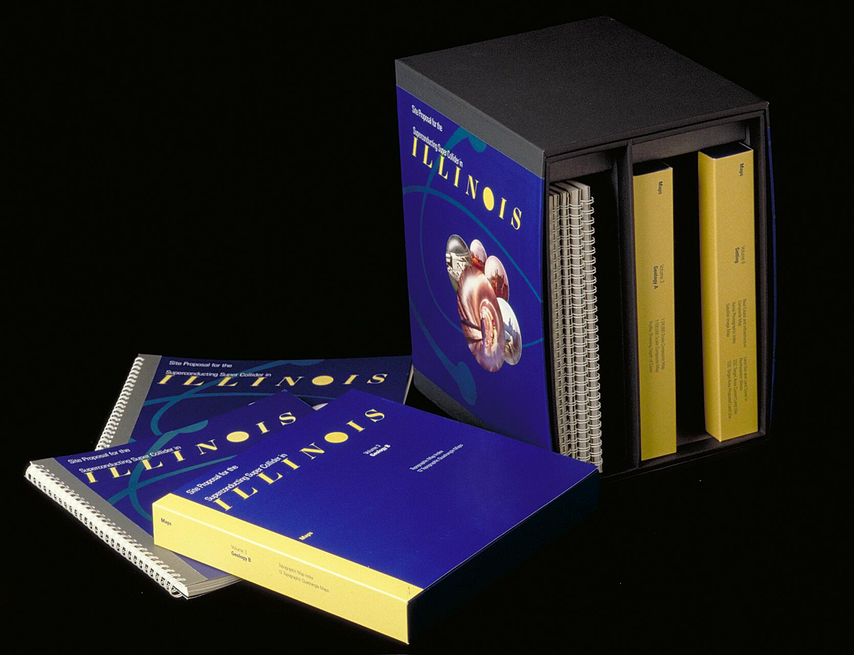 Blue and yellow documents labeled "Illinois" in spiral bindings and a black box set against a black background.