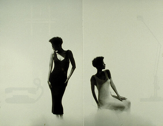 Two silhouettes of women in fitted dresses. The left woman stands in a black dress, looking down, while the right woman sits in a white dress, looking to the left; both against a minimalist, light-colored background.