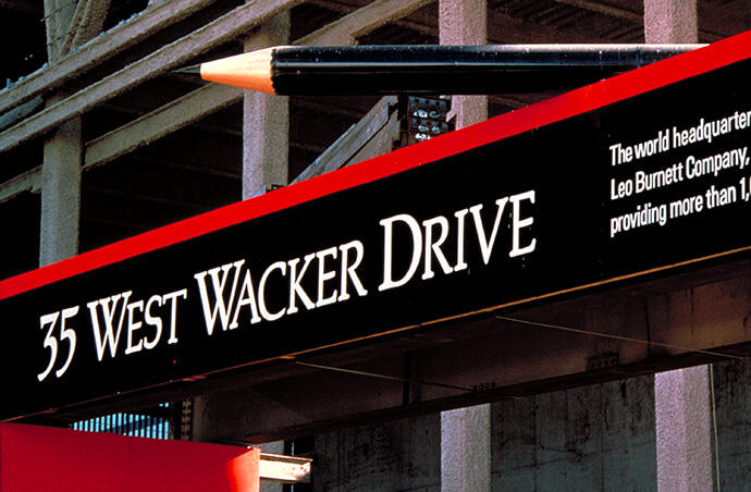35 West Wacker Drive sign with a giant black pencil on top.
