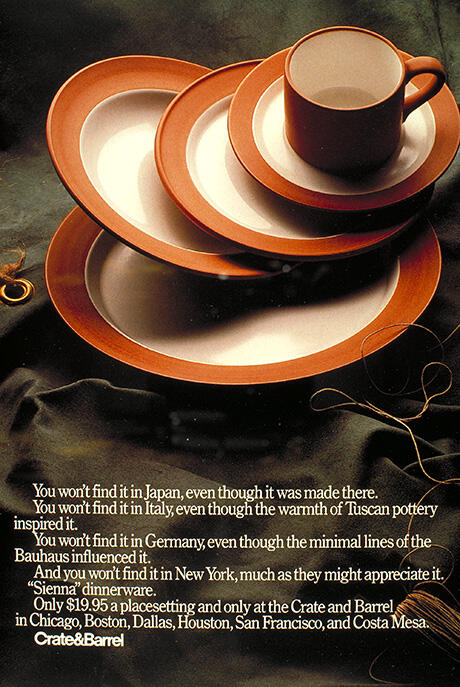 A set of Siena dinnerware, including a cup, saucer, and plates, with earthy brown rims, set against a dark fabric background. White text below and beside promotes the product and availability.