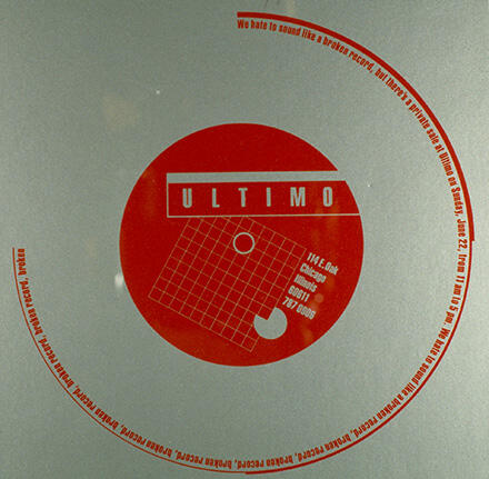 Red and silver graphic featuring a red circle with the word "ULTIMO" and grid design. Text arcs around the circle.
