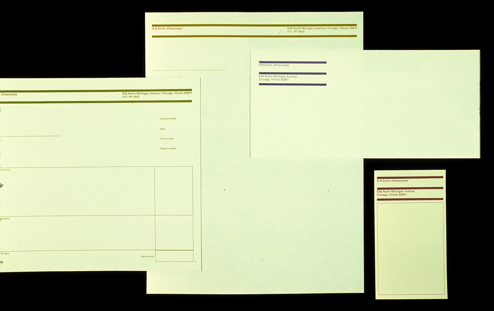 Stationery set including a letterhead, business card, and envelopes, each featuring "H.B. Smith D'Associates" with contact details and different colored headers on a black background.
