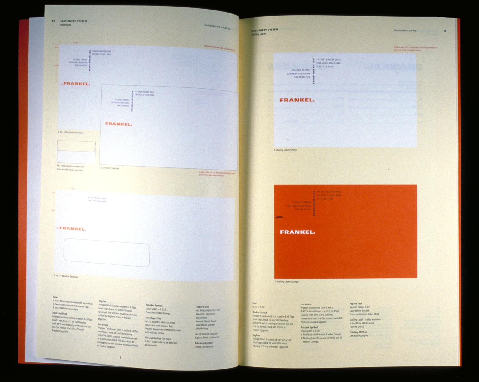 Open book showing stationery designs labeled "Frankel," featuring envelopes and mailing labels. One page shows white layouts with text and dimensions, while the opposite page has a bold orange mailing label design, with specifications below.